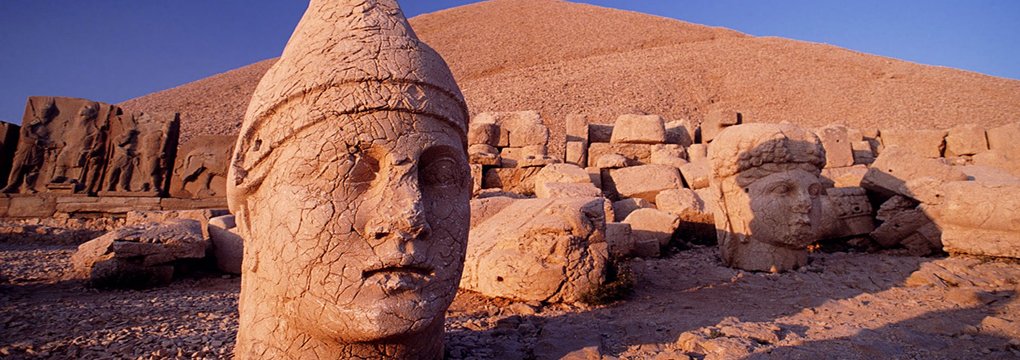 Ancient statues overlooking the Mount Nemrut landscape